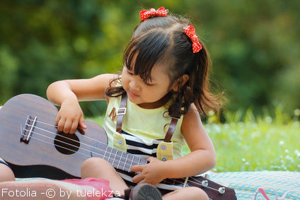 Little child with ukulele